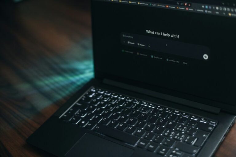 Laptop screen showing an AI assistant asking how it can help