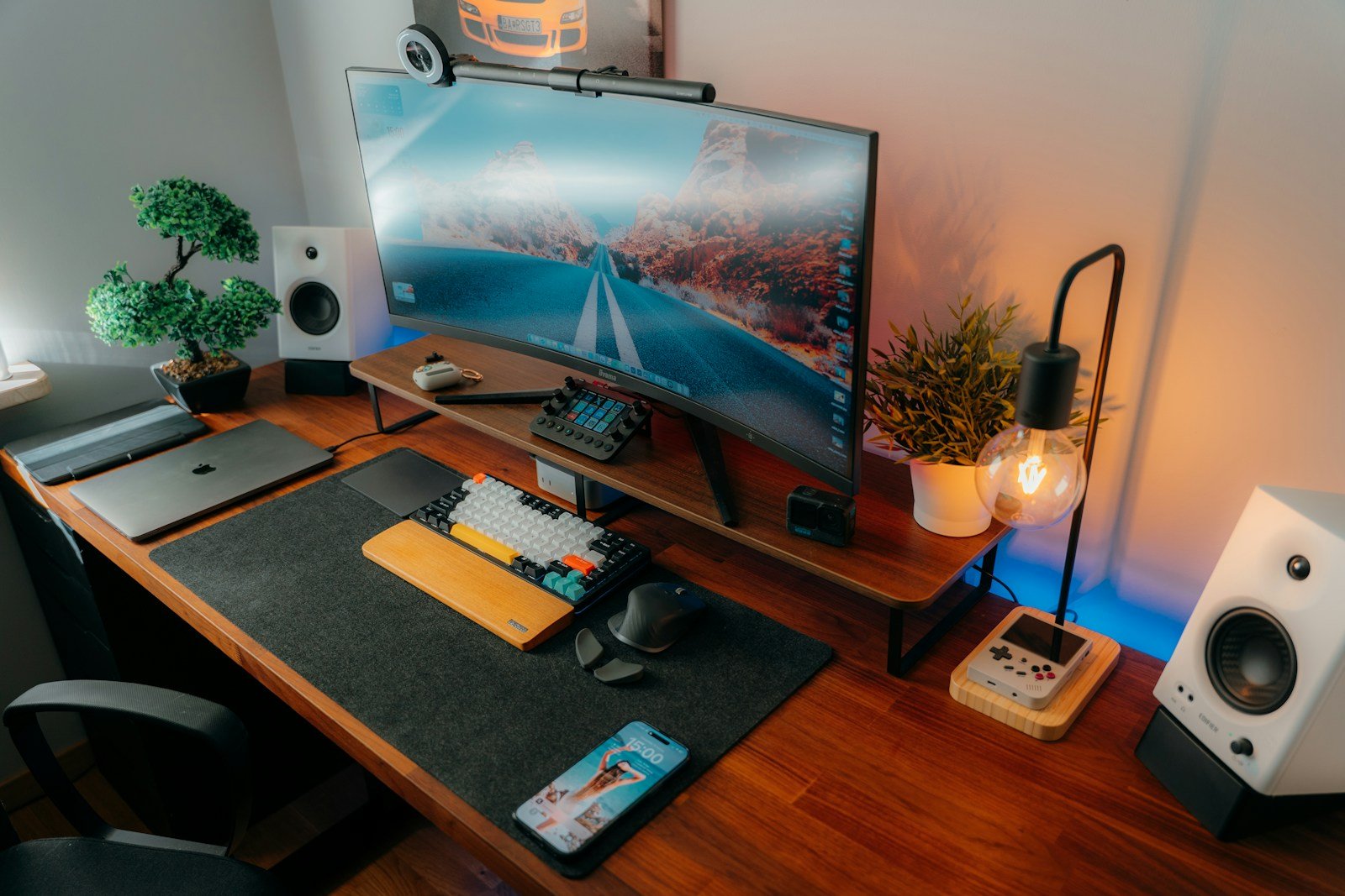 Tidy home office desk with a monitor, keyboard and no visible cables