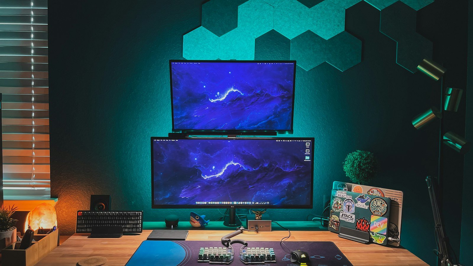 Computer monitor on a wooden desk in a developer workspace