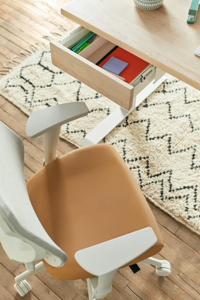 Office chair pulled up to a home office desk