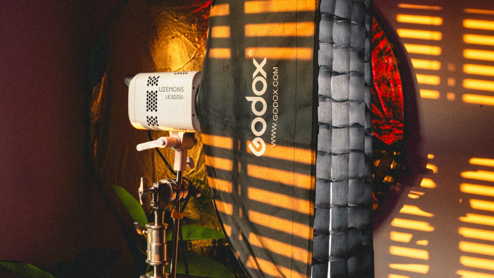 Studio light with a softbox on a stand, the kind of key light used in YouTube setups