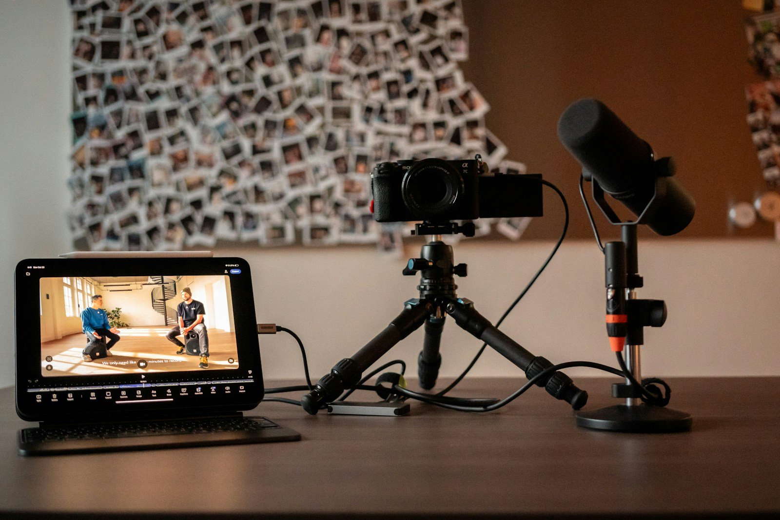Camera, microphone and monitor set up on a desk for recording YouTube videos
